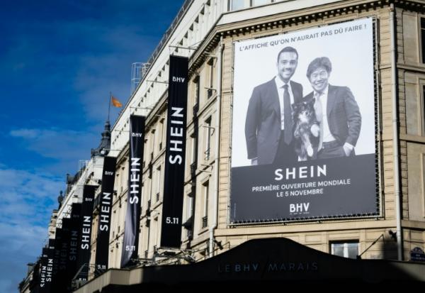 Publicité sur une façade du Bazar de l'Hotel de Ville (BHV) à Paris, le 3 novembre 2025, annonçant l'ouverture d'un espace Shein pour le 5 novembre  