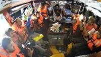 Image tirée d'une vidéo publiée par la Coalition de la flottille pour la liberté, le 9 juin 2025, montrant des militants à bord du bateau Madleen à destination de Gaza, les mains en l'air, alors qu'ils sont interceptés par les forces israéliennes dans les eaux internationales avant d'atteindre le territoire palestinien