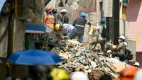 Les secouristes recherchent d'éventuels survivants, à Pereira en Colombie, le 14 août 2026
